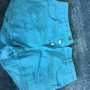 Bright blue denim high rise distressed jean shorts